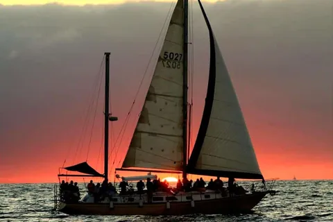The Alebrije 50 at sunset with guests on deck